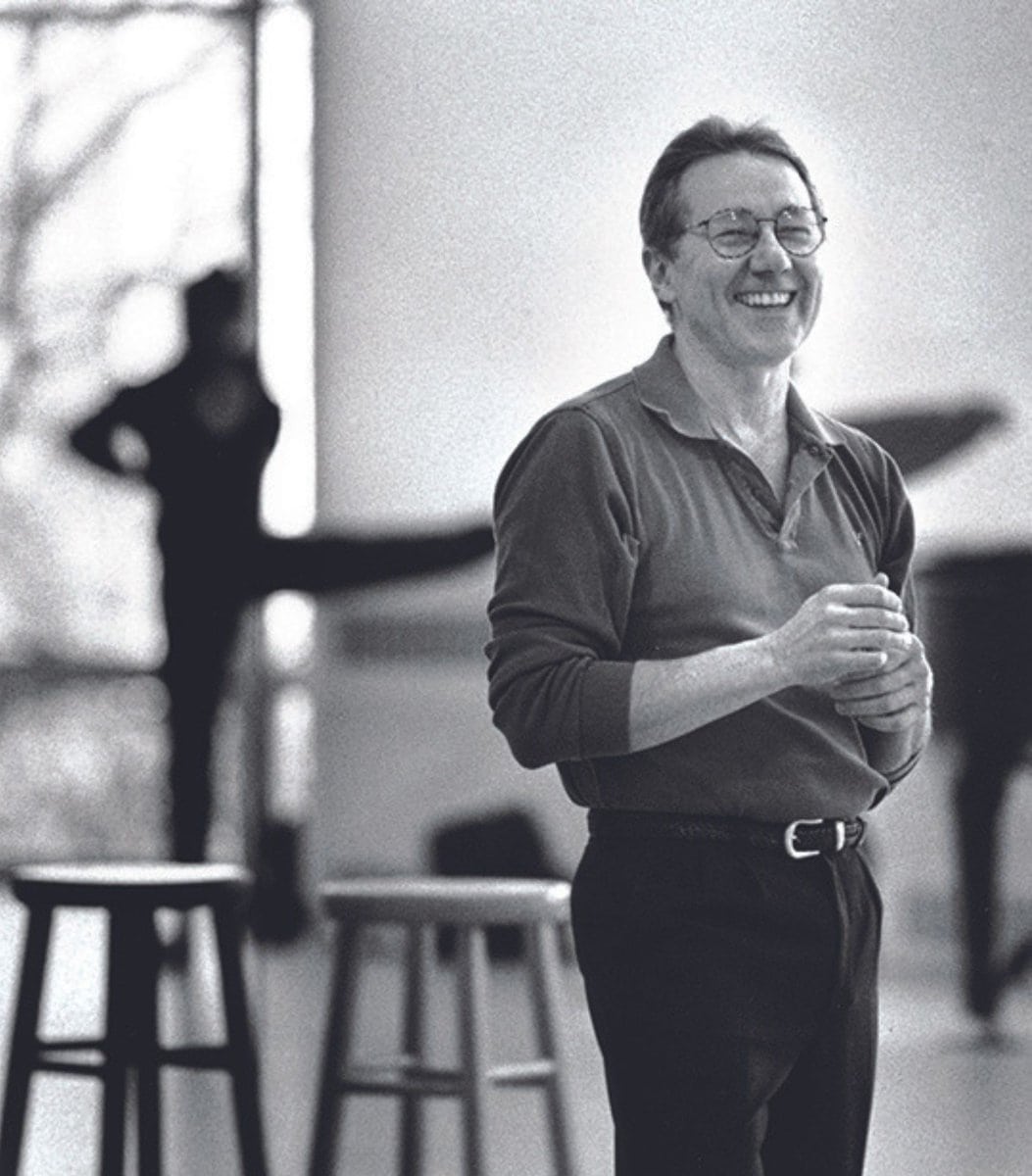 1993_Kent_KurtSmithPhotoresize Kent Stowell stands grinning in a studio at the Phelps Center.