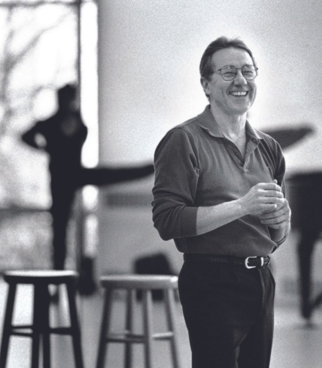 Kent Stowell stands grinning in a studio at the Phelps Center.