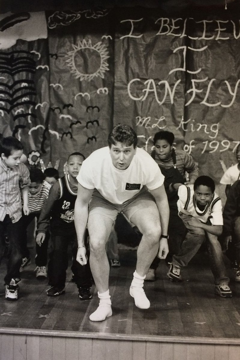 1997 Phil Otto resize Discover Dance's first director, Phil Otto, dances onstage with a class of elementary school students.