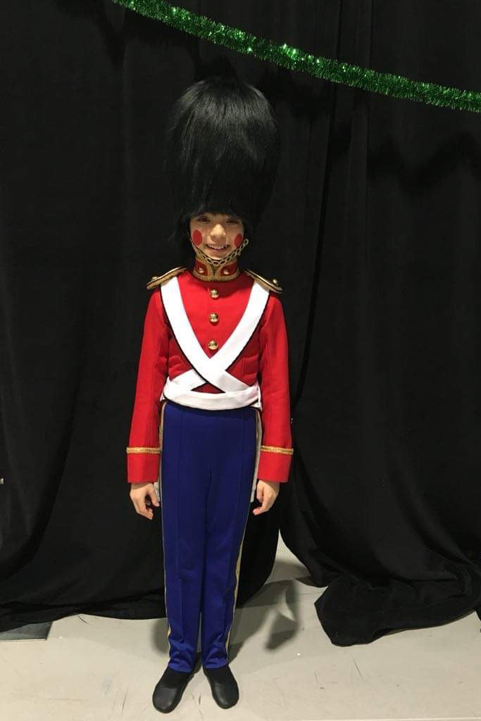 Emerson Boll as a young dancer in a soldier costume