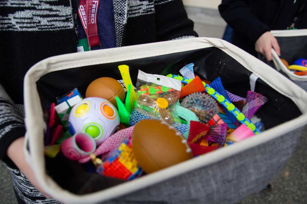 A cloth box full of colorful fidget toys.