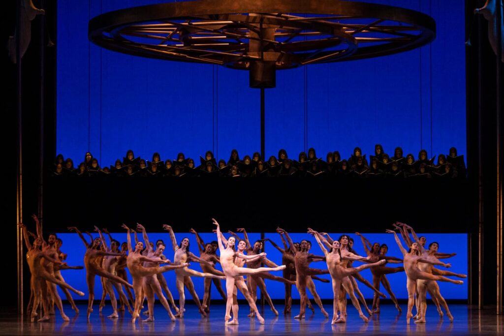 Lesley Rausch, Lucien Postlewaite, and PNB company dancers in Kent Stowell's Carmina Burana. Photo © Angela Sterling.
