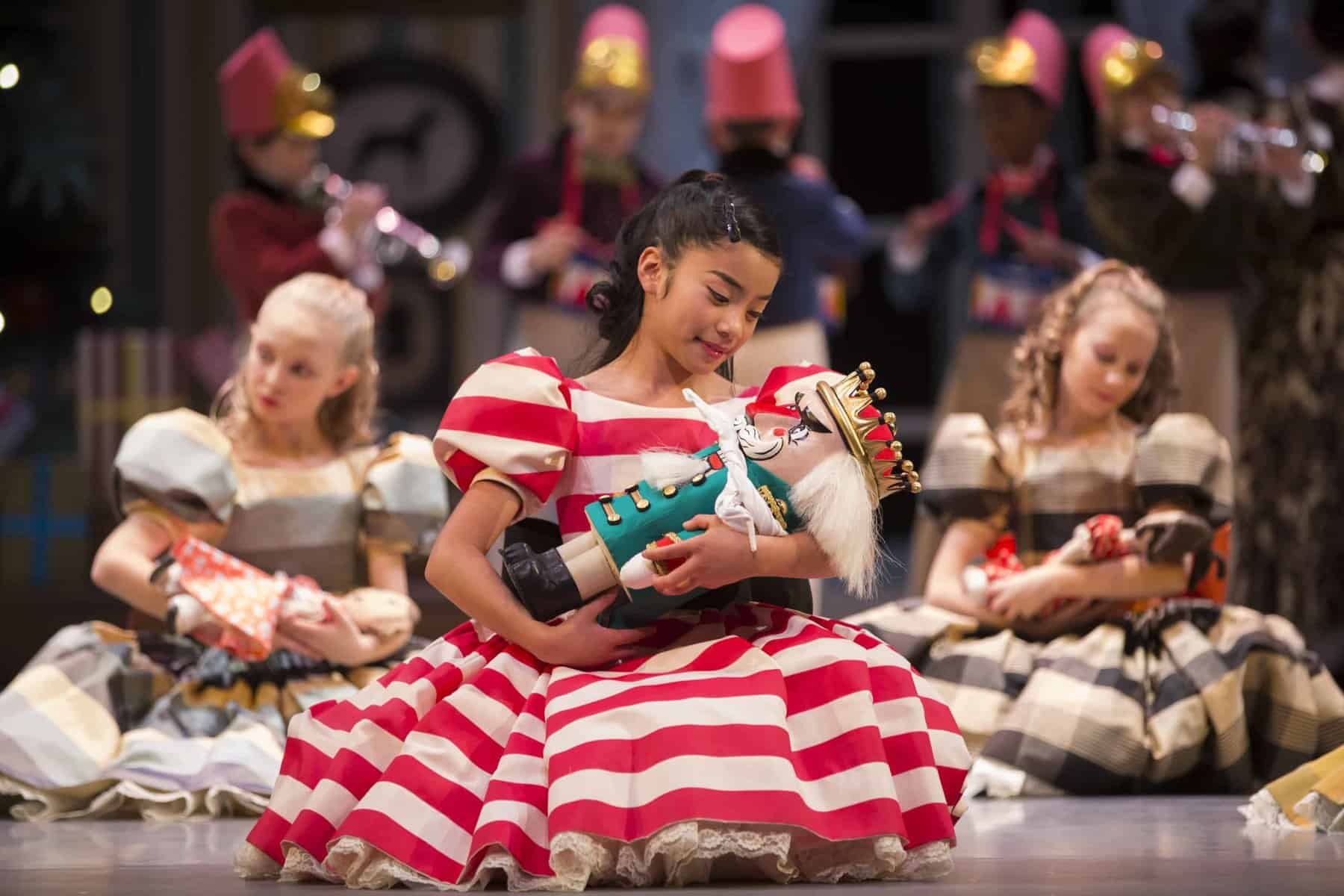 Clara with her Nutcracker doll. George Balanchine's The Nutcracker®, choreography by George Balanchine © The George Balanchine Trust. Photo © Angela Sterling.